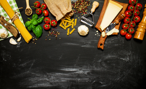 Top view of a table with vegetables and ingredients prepared for cooking